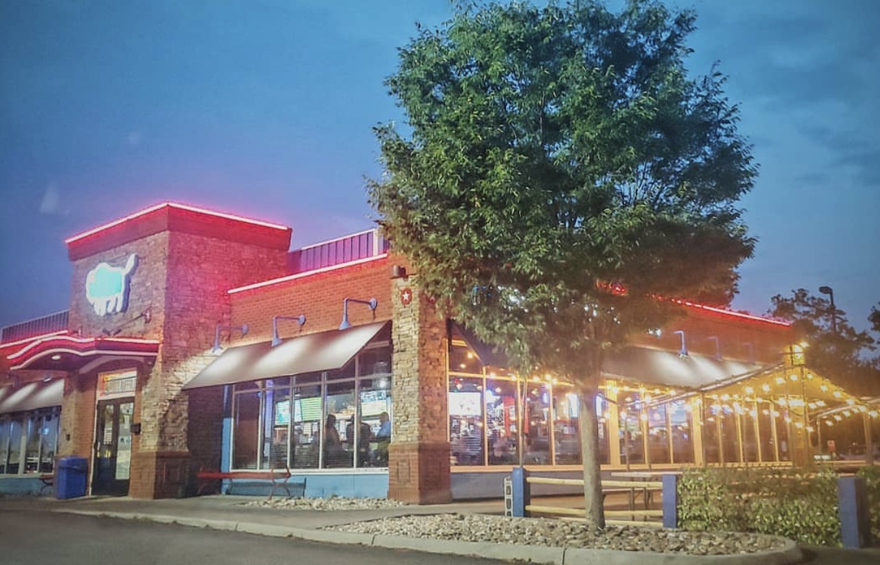 The Dirty Buffalo storefront at dusk in Norfolk, Virginia