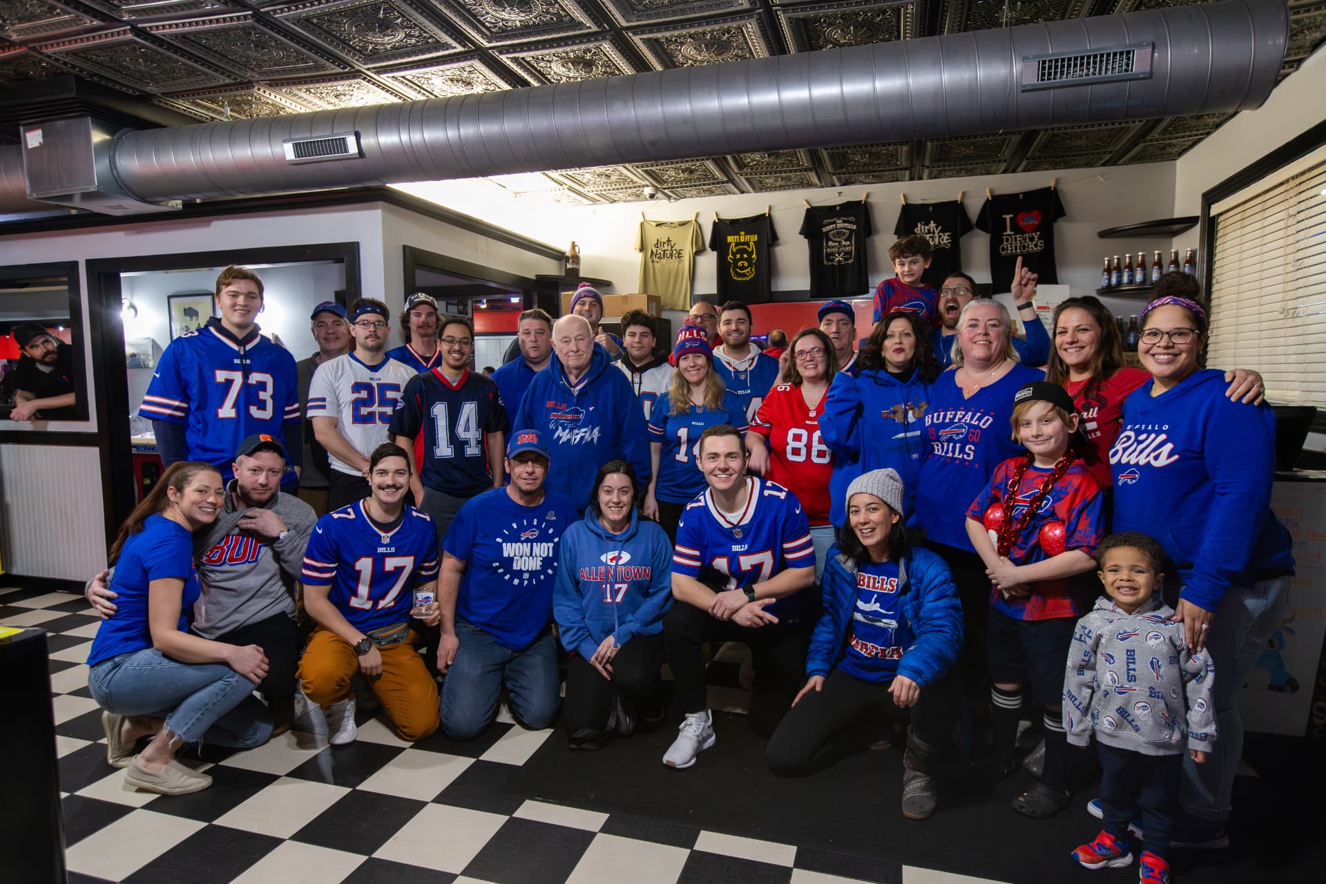Guests in Dirty Buffalo shirts watching the game at the Colley Ave location